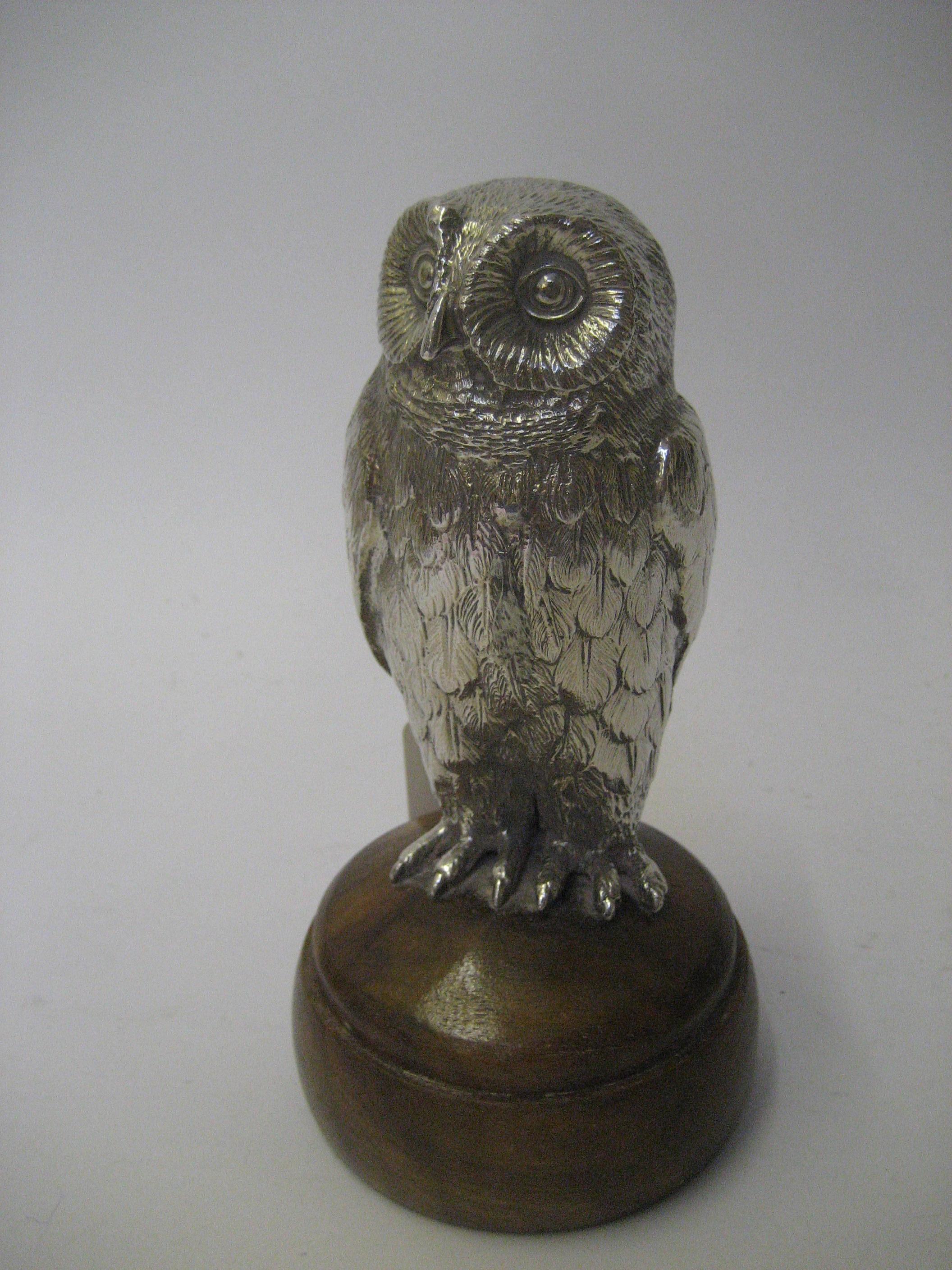 Appraisal: A HOLLOW CAST MODEL OF AN OWL perched upon a