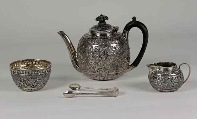 Appraisal: A Victorian three-piece silver tea set Charles Boyton London profusely