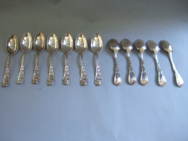 Appraisal: Eleven mostly Sterling large teaspoons each of cast scrolling design