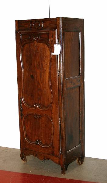 Appraisal: A Louis XV oak bonnetiere mid th century lacking cornice