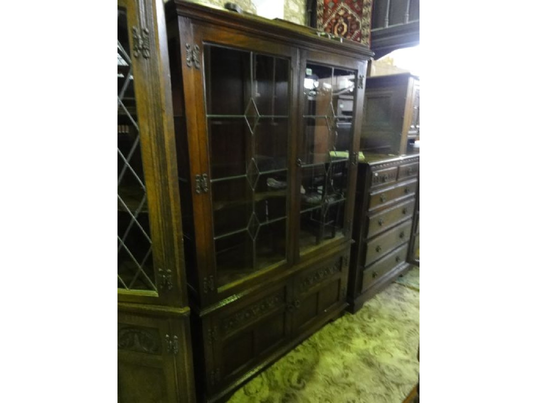 Appraisal: An Old Charm oak display cabinet freestanding and enclosed by