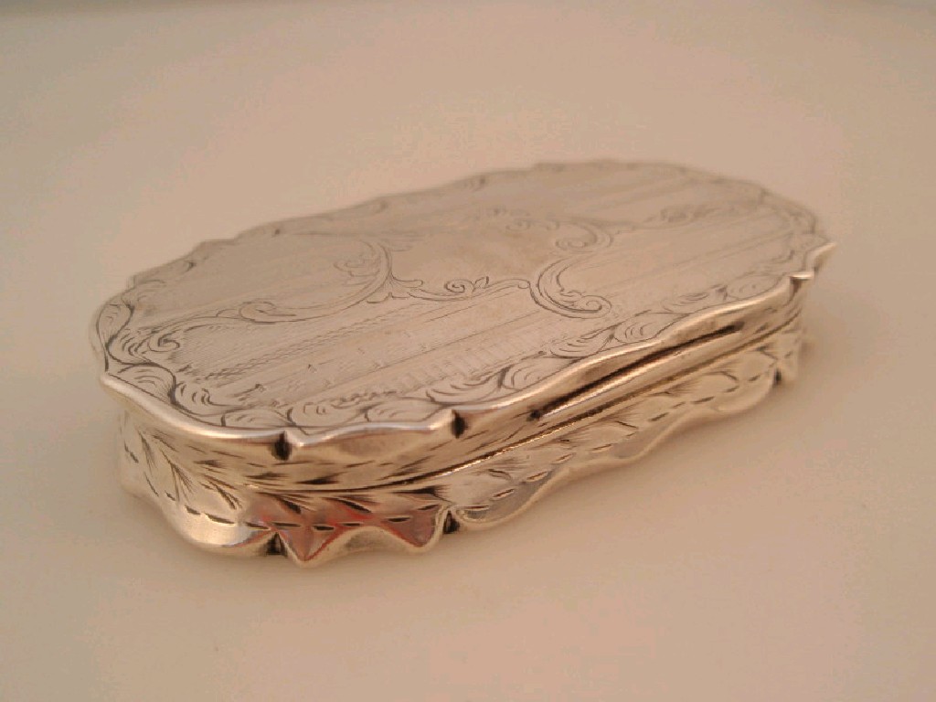 Appraisal: A Victorian silver snuff or comfit box with acanthus trails