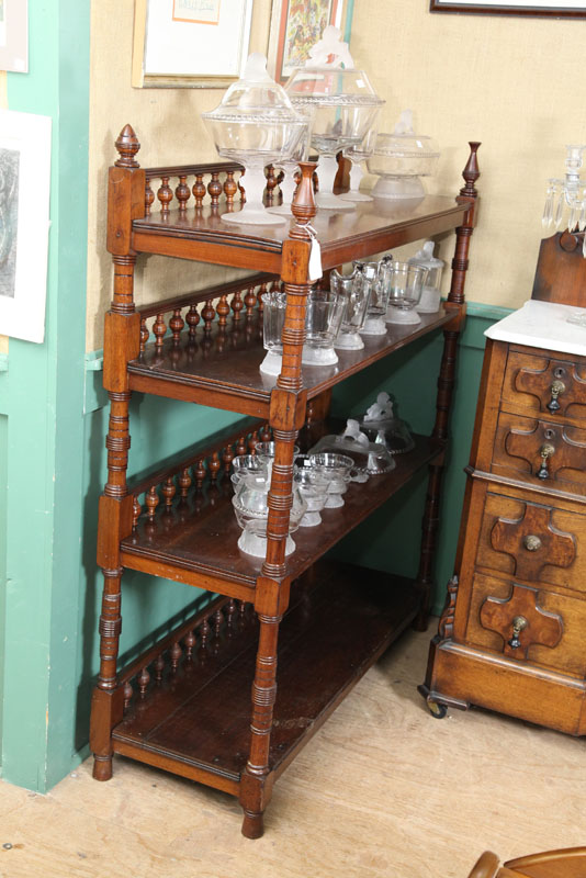 Appraisal: BOOKSHELF Four tiered walnut bookshelf with bannister galleries and turned