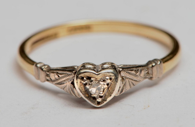 Appraisal: AN CT GOLD AND PLATINUM DIAMOND RING with heart shaped