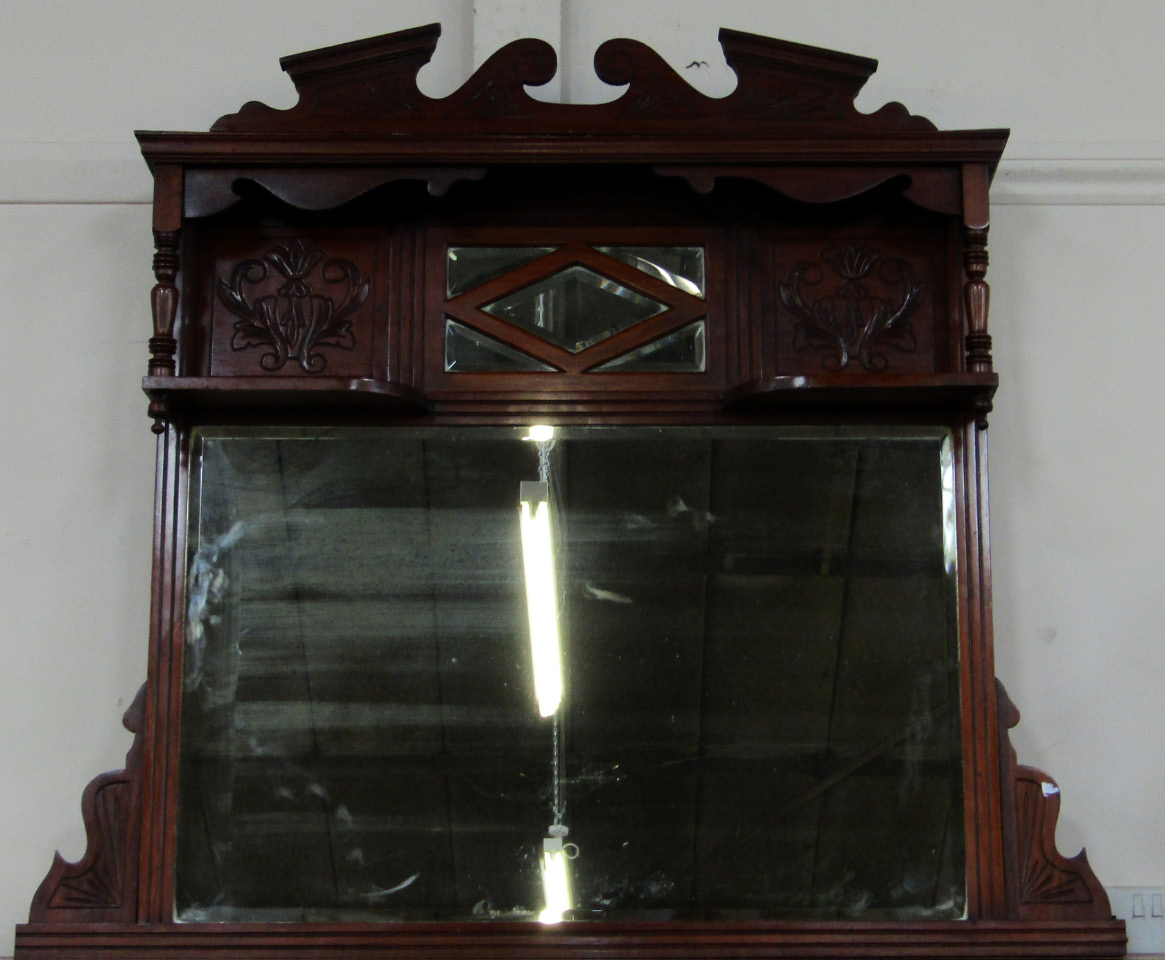 Appraisal: A Victorian mahogany overmantel mirror with a swan neck pediment