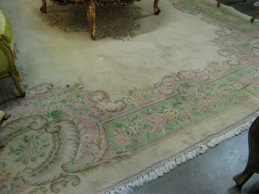 Appraisal: HAND KNOTTED ORIENTAL CARPET Indo-Aubusson central floral medallion on plain