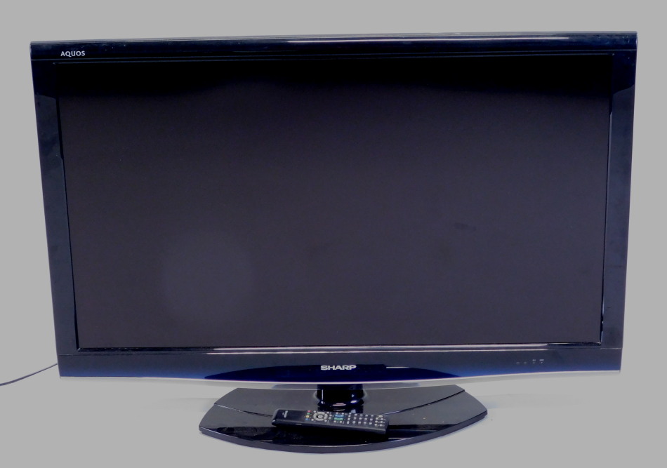 Appraisal: A Sharp Aquos colour television in black trim with remote