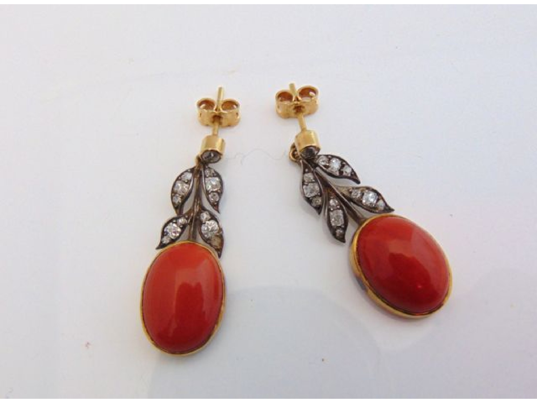 Appraisal: A pair of Victorian coral and diamond drop earrings each