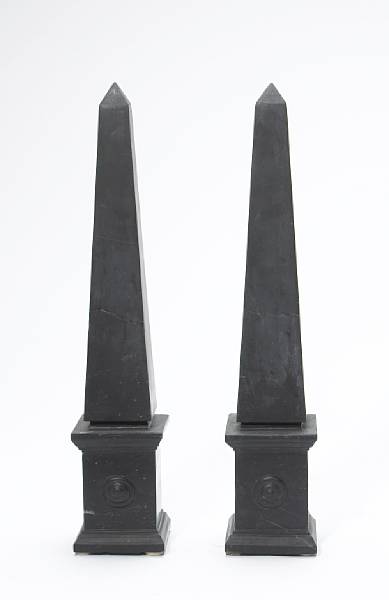 Appraisal: A pair of black marble obelisks modern Of typical form