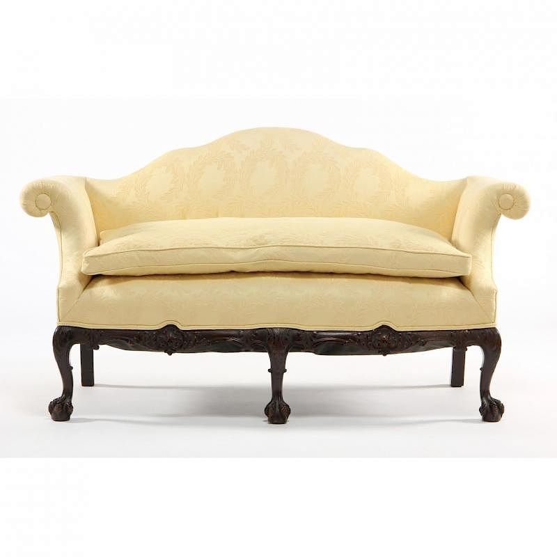 Appraisal: George II Style Carved and Upholstered Sofa circa shaped crest