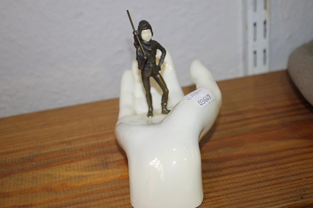 Appraisal: A MINTON MODEL OF TOM THUMB standing in an open