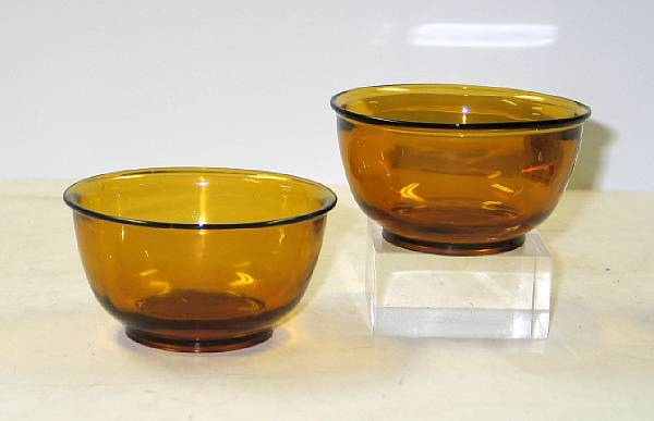 Appraisal: A pair of amber glass bowls th Century Each formed