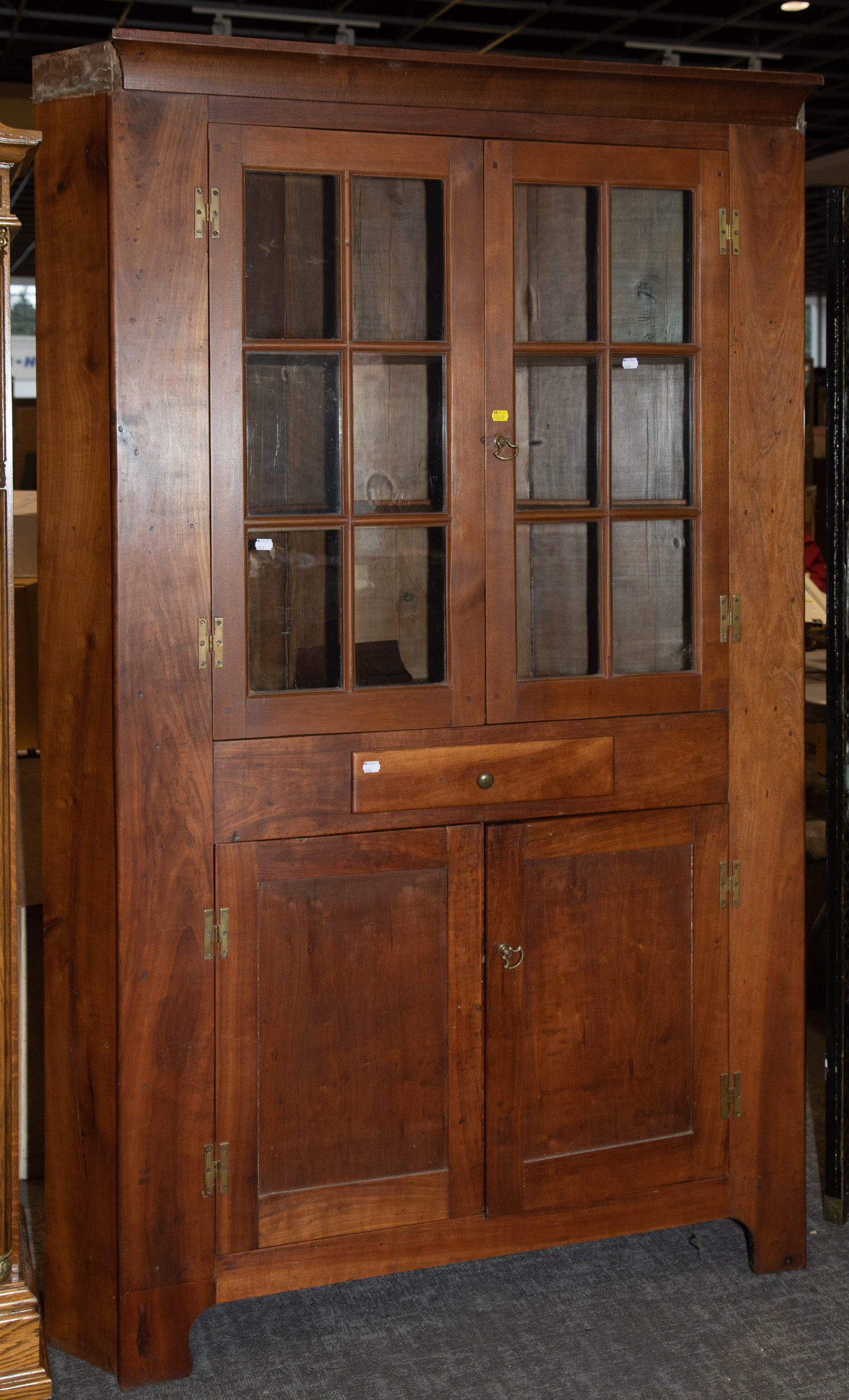 Appraisal: AMERICAN VERNACULAR STYLE CHERRY CORNER CUPBOARD Rebuilt from old parts