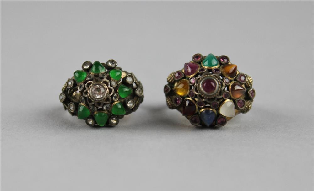 Appraisal: TWO THAI GOLD AND GEMSTONE SET COCKTAIL RINGS the first