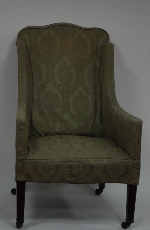 Appraisal: A Victorian mahogany wing back armchair on square tapering legsProvenance