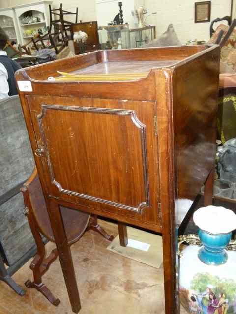 Appraisal: A MAHOGANY POT CUPBOARD with single panelled door standing on