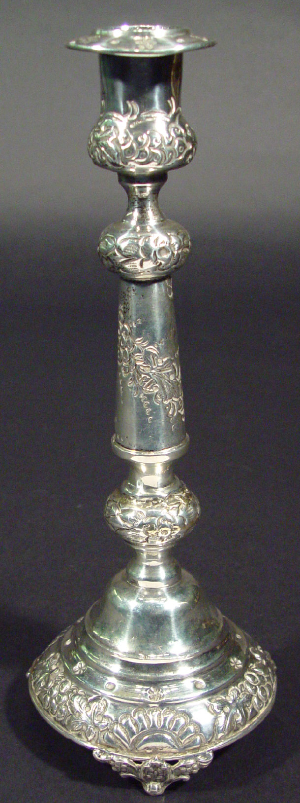 Appraisal: Floral embossed silver candlestick London cm high