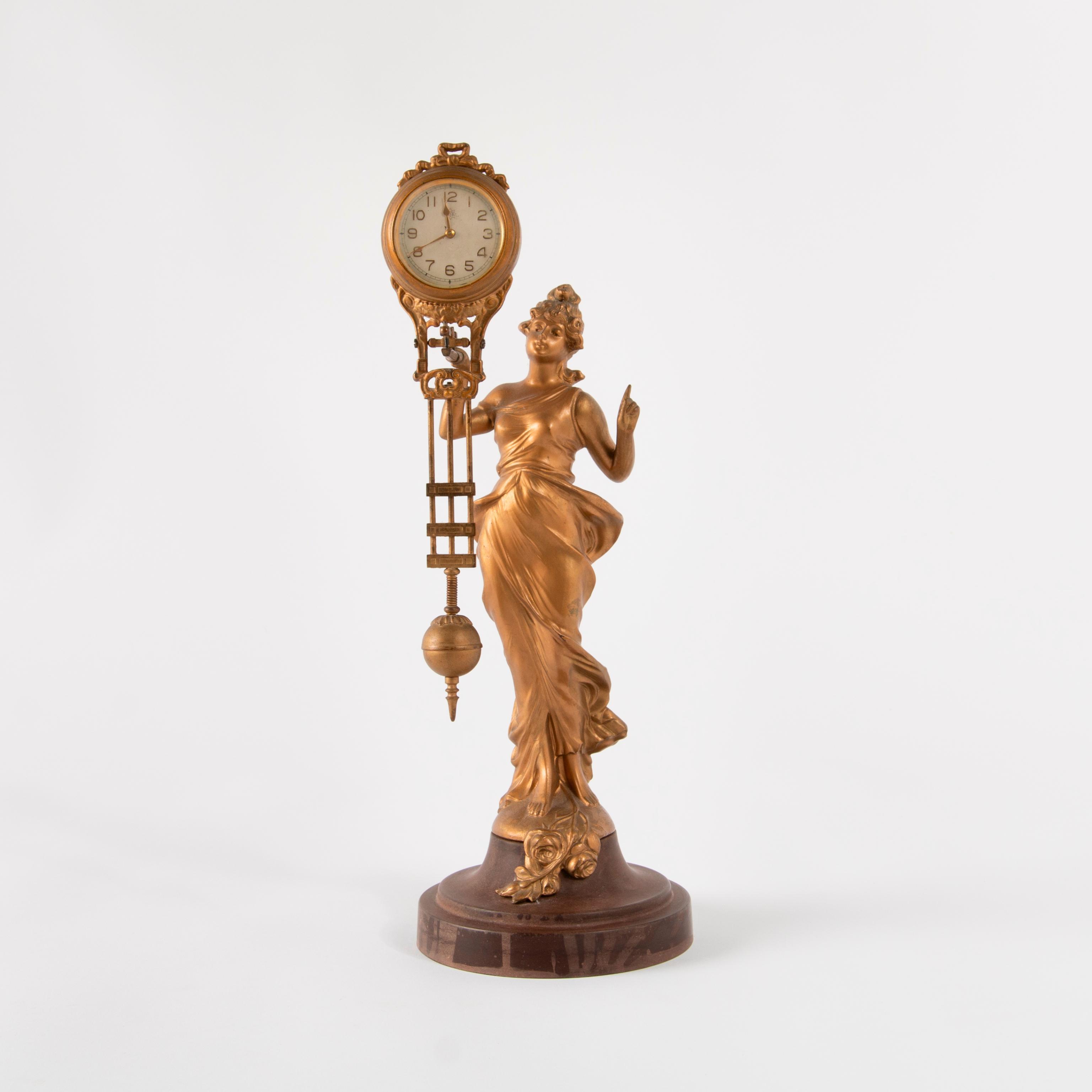 Appraisal: SWINGING DIANA FIGURAL NOVELTY SWINGER CLOCK An Art Nouveau style