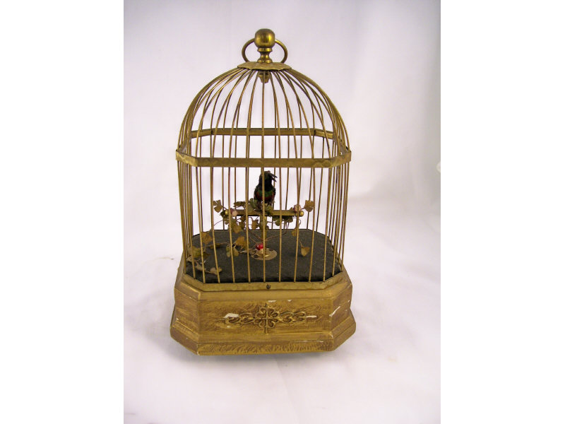 Appraisal: German Mechanical Bird in Cage Single mounted bird in gilt