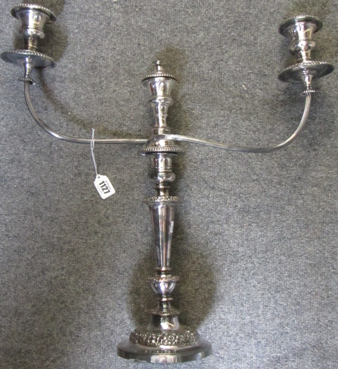 Appraisal: A pair of three light plated on copper table candelabra