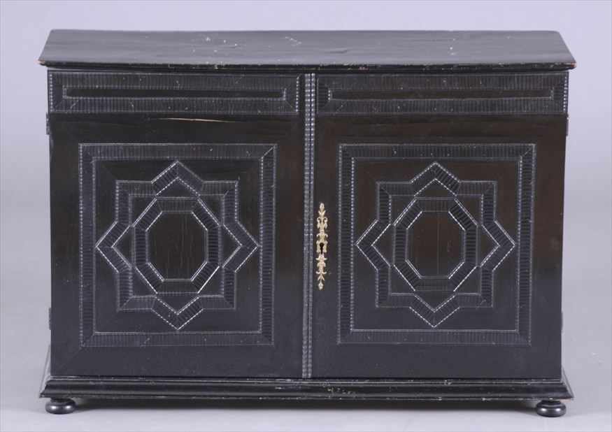 Appraisal: FRENCH BAROQUE EBONIZED CABINET Enclosed by a pair of doors