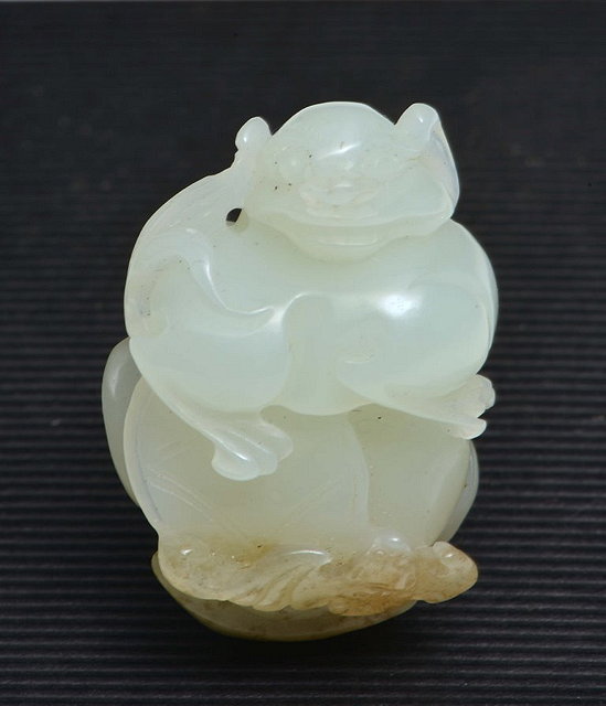 Appraisal: A CHINESE JADE PALE GREEN SMALL CARVED LION DOG with