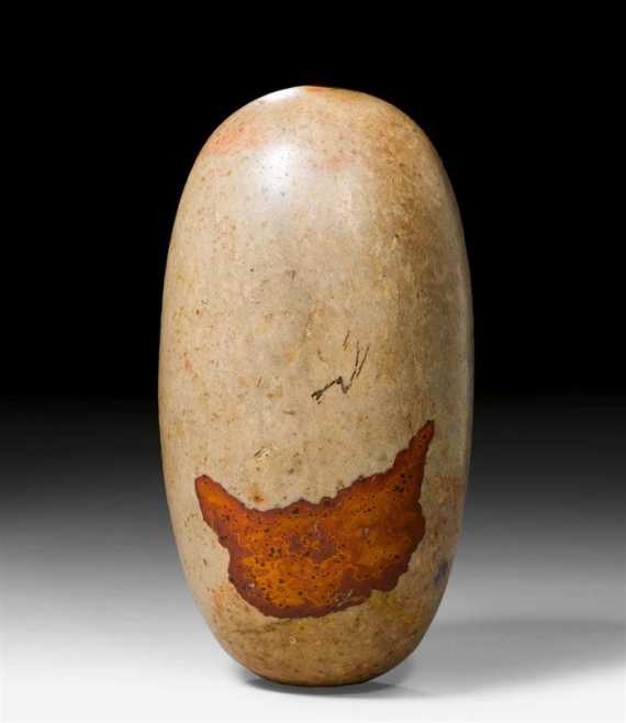 Appraisal: A NATURALLY SHAPED PEBBLE LINGAM India length cm