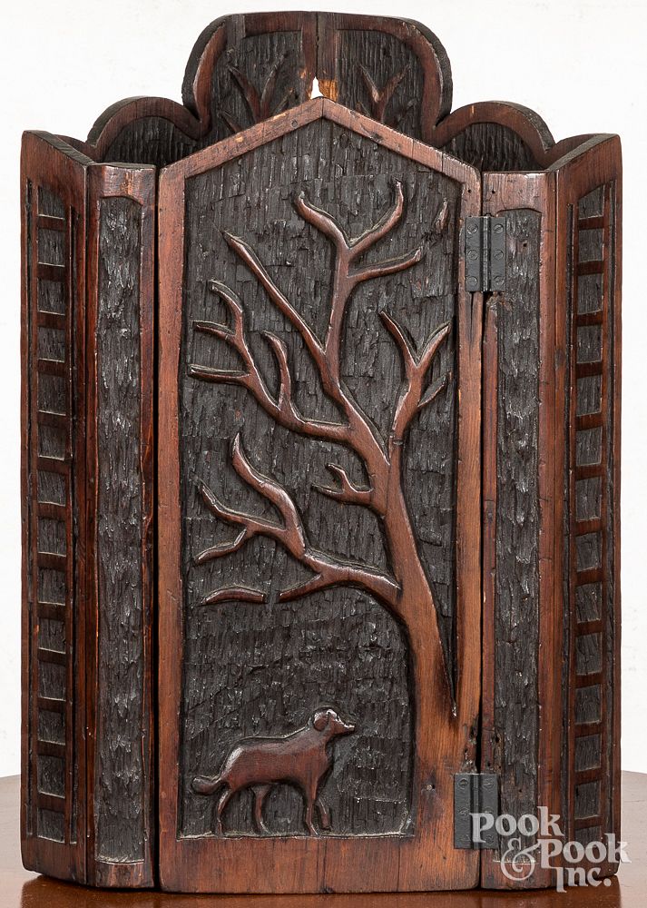 Appraisal: Folk art carved pine hanging corner cupboard Folk art carved