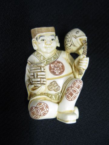 Appraisal: Carved Ivory Netsuke of Seated Man holding a basket with