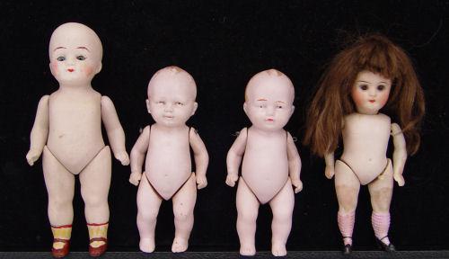 Appraisal: GERMAN BISQUE DOLLS All bisque head body and limbs with