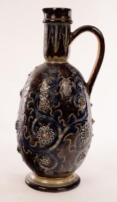 Appraisal: A Doulton Lambeth ewer by George Tinworth decorated raised flowerheads