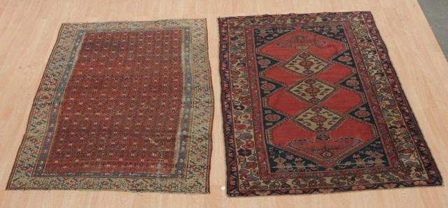 Appraisal: A South Caucasian rug with central panel of repeating flowers