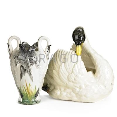 Appraisal: MAJOLICA DELPHIN MASSIER SWANS Figural planter and vase early th