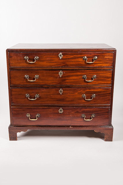 Appraisal: A TH CENTURY MAHOGANY CHEST of four long drawers with