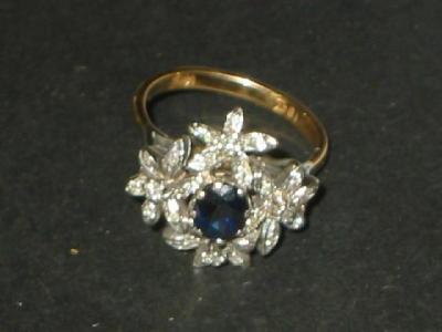 Appraisal: A SAPPHIRE AND DIAMOND DRESS RING the central oval cut