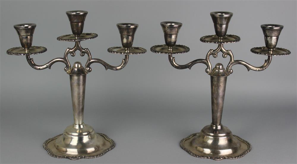 Appraisal: PAIR OF MEXICAN STERLING SILVER THREE-LIGHT CANDELABRA mid th Century