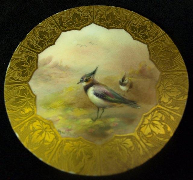 Appraisal: A Royal Worcester circular plaque painted lapwings in a gilt