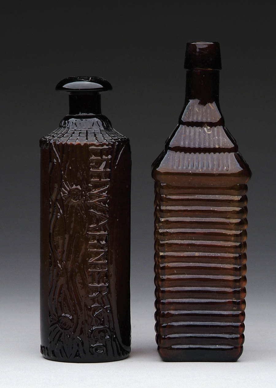 Appraisal: TWO FIGURAL AMBER BITTERS BOTTLES Tippecanoe One side embossed Tippecanoe