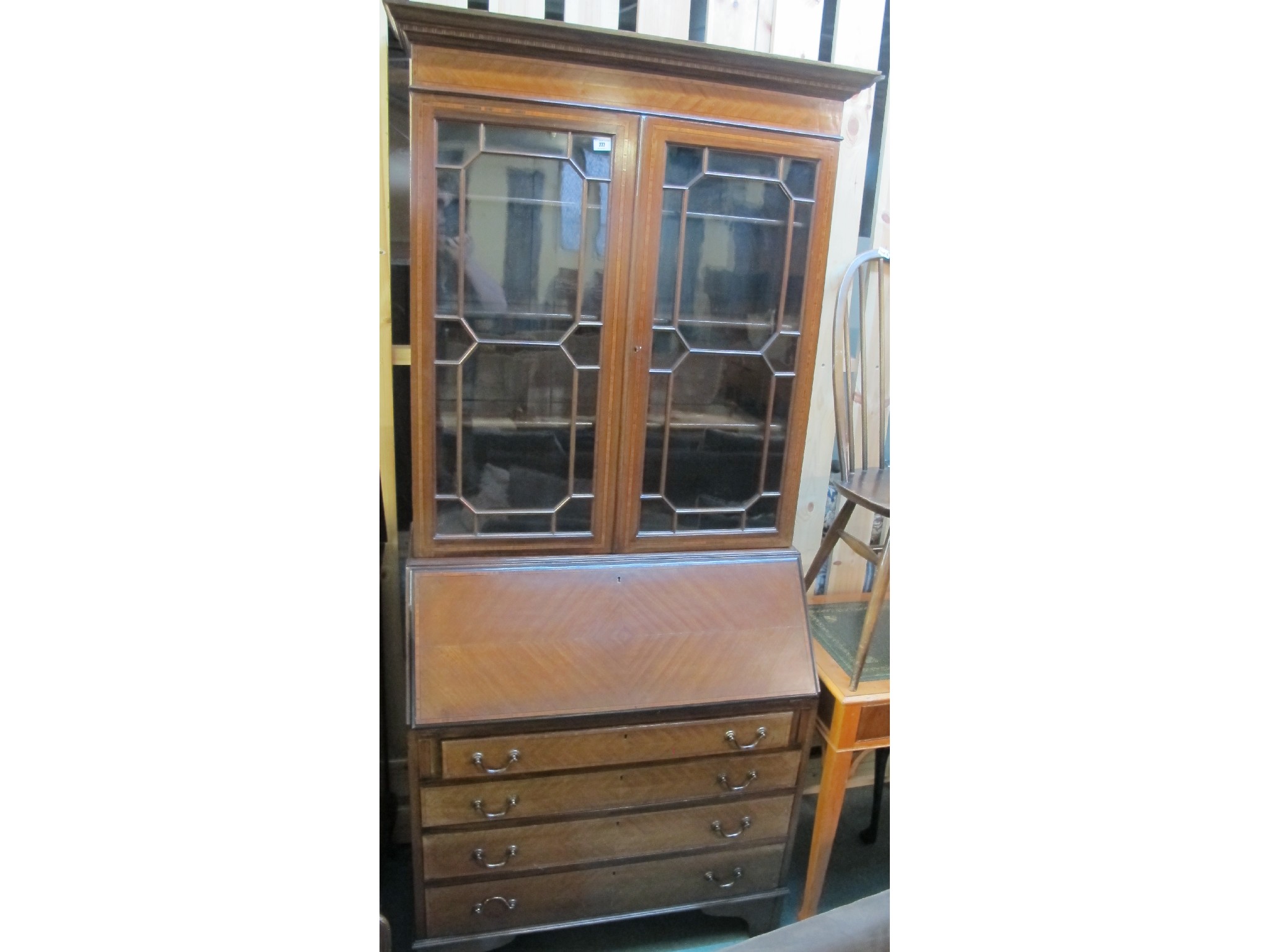 Appraisal: An Edwardian mahogany astragal glazed bureau bookcase