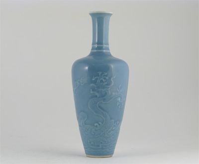 Appraisal: A Chinese lavender glaze vase embossed with a fierce dragon