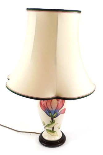 Appraisal: A Moorcroft pottery table lamp decorated in the Magnolia pattern