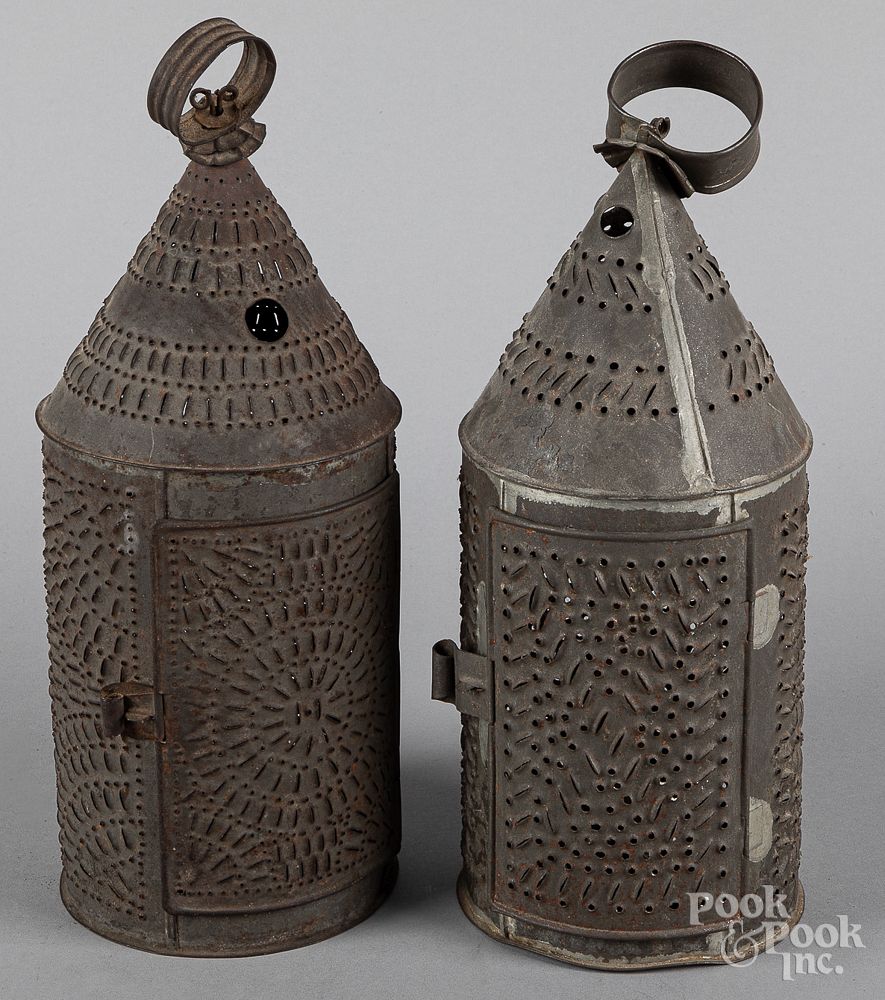 Appraisal: Two punched tin carry lanterns th c Two punched tin