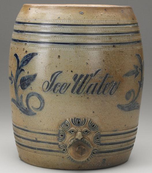 Appraisal: STONEWARE ICE WATER COOLER With incised blue decoration and figural