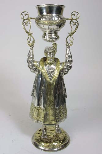 Appraisal: GERMAN STERLING SILVER-GILT FIGURAL WEDDING CUP The standing figure of