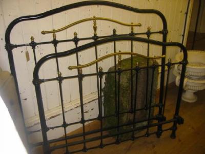 Appraisal: A VICTORIAN CAST IRON BEDSTEAD of slatted form and black