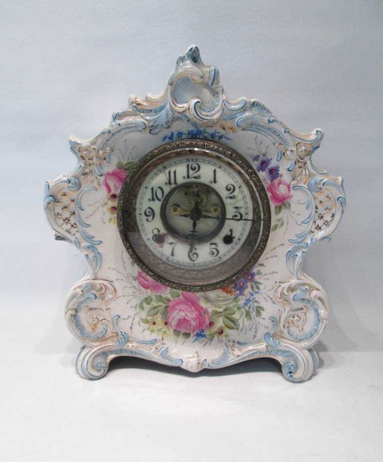 Appraisal: A ROYAL BONN NEW HAVEN PORCELAIN SHELF CLOCK with time