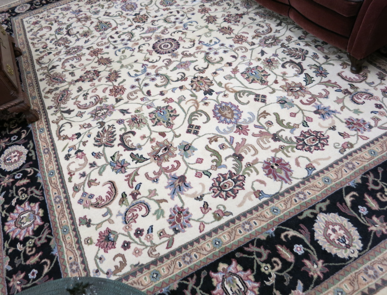 Appraisal: HAND KNOTTED ORIENTAL CARPET Indo-Persian overall floral design on cream