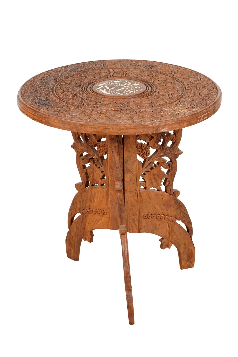 Appraisal: MOROCCAN CARVED TABORETwith inlaid center top surrounded by carved floral