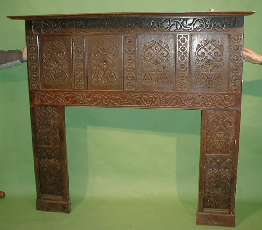 Appraisal: A carved oak fire surround assembled from period timbers high