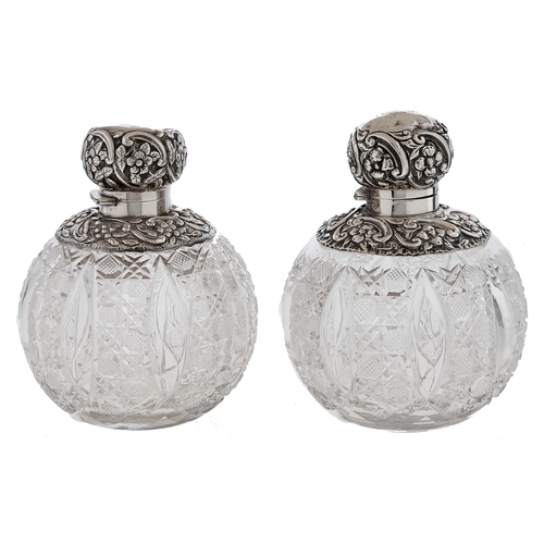 Appraisal: A pair of Edwardian silver mounted globular cut glass scent